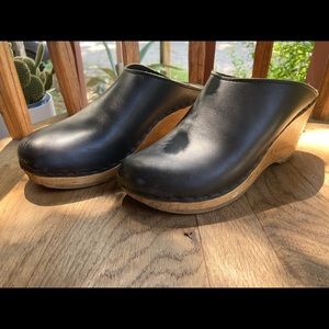 Sven black leather clogs.